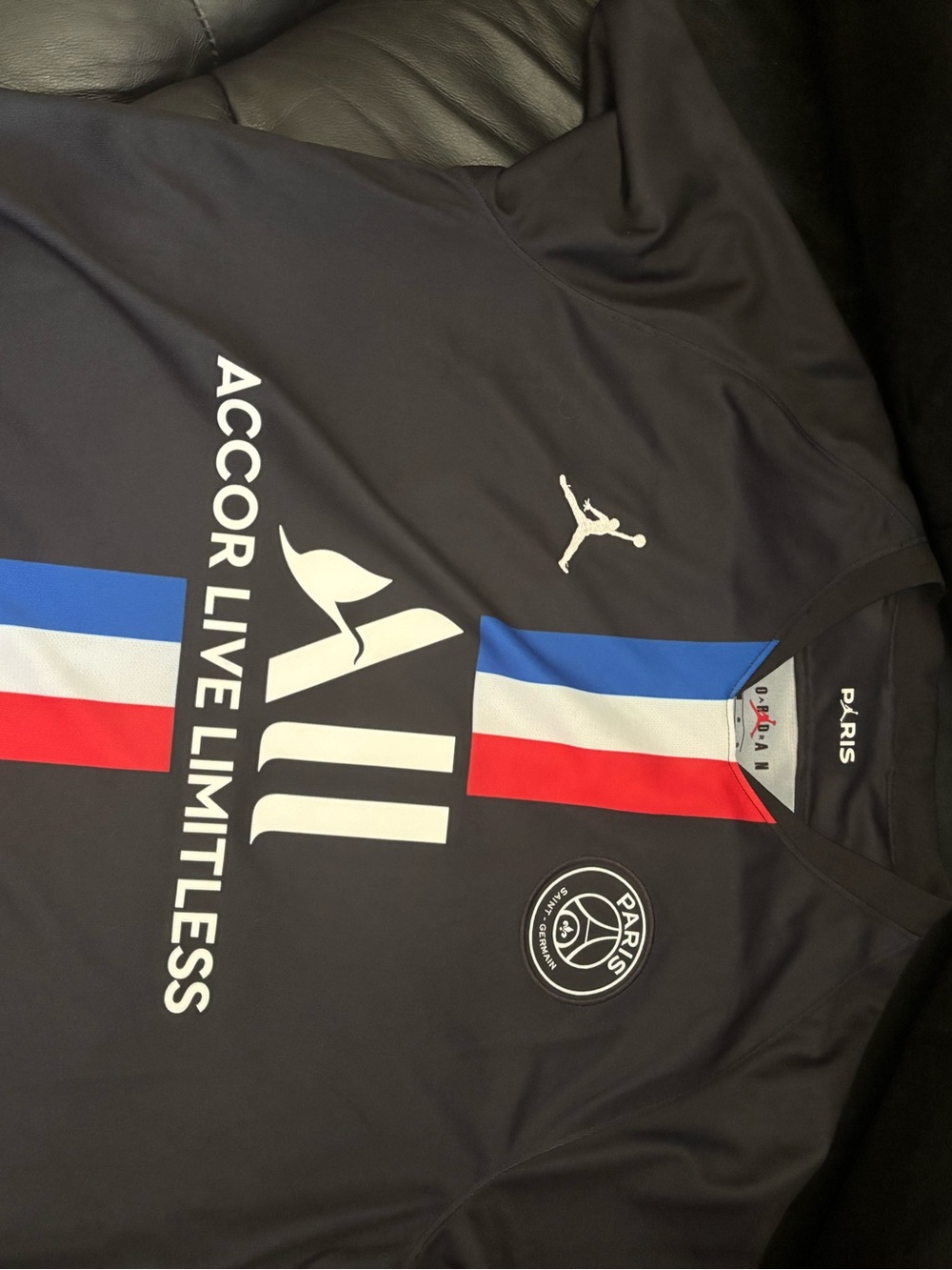 Jordan Men’s Black PSG Football Jersey with Red, White & Blue Stripes